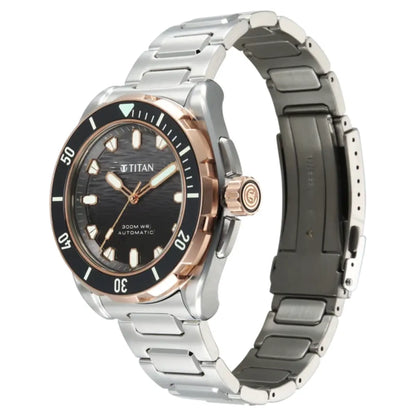 A stainless steel and rose gold Titan watch with a black dial and bezel, displayed on a clean white background.