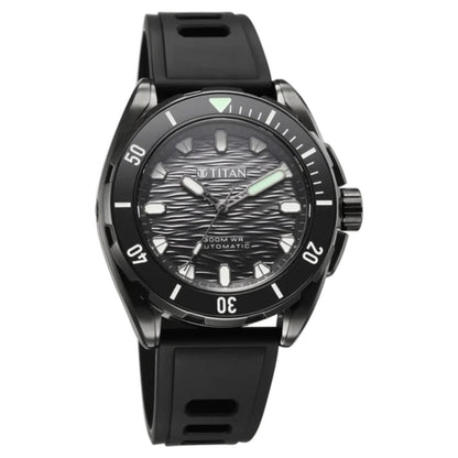 A Titan brand automatic watch with a black bezel, textured black dial, and black strap, shown against a plain white background.