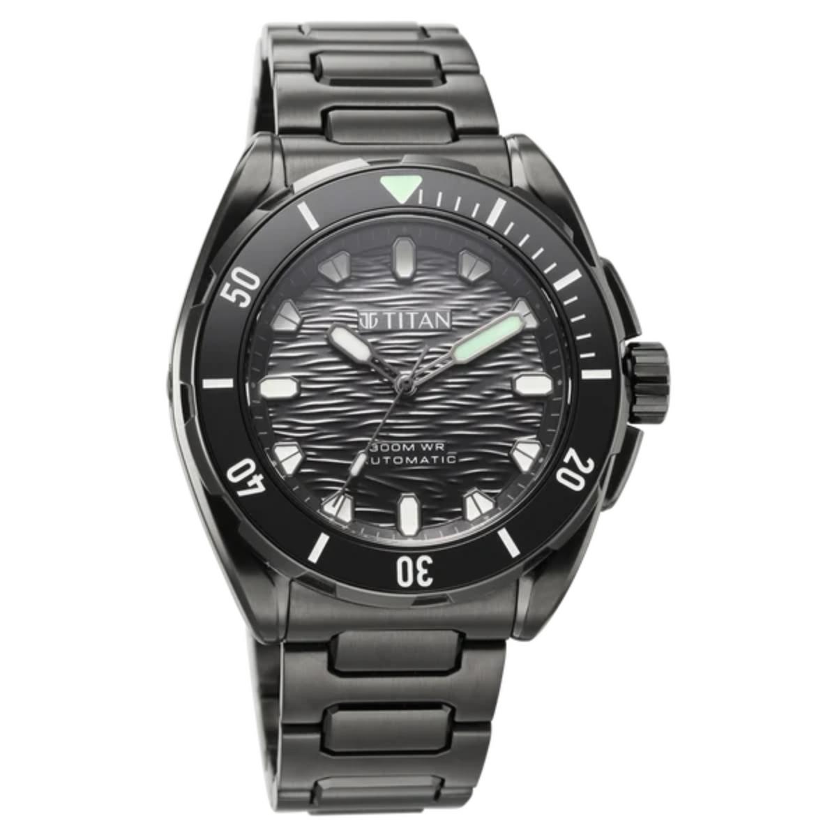 A black titanium automatic watch with a textured dark gray dial, black bezel, and matching black metal link bracelet, shown against a plain white background.
