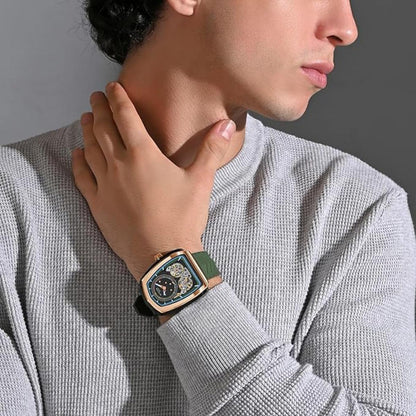 Person wearing a watch with a detailed face, dressed in a gray sweater.