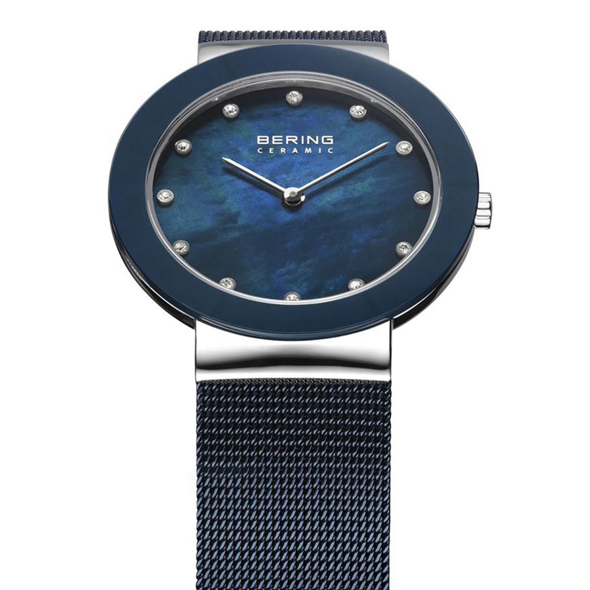 Blue watch with mesh band on a white background