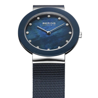Blue watch with mesh band on a white background