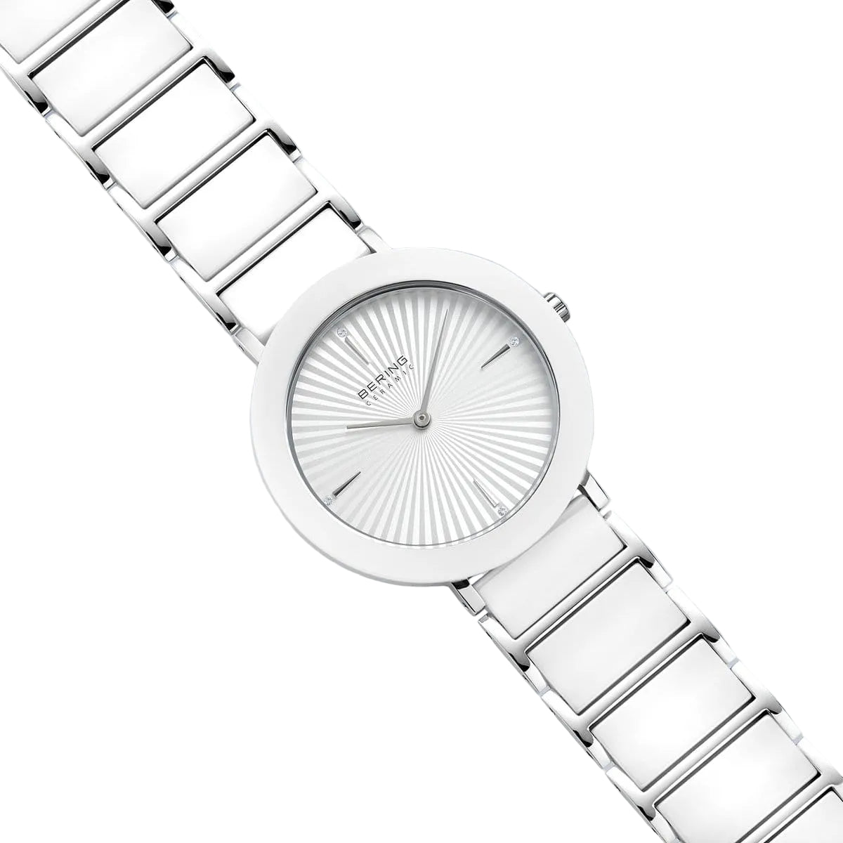 Silver watch with a detailed face on a light gray background