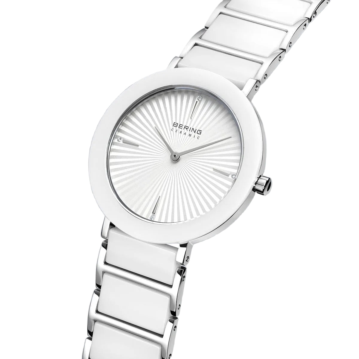 Silver watch with a detailed face on a light gray background
