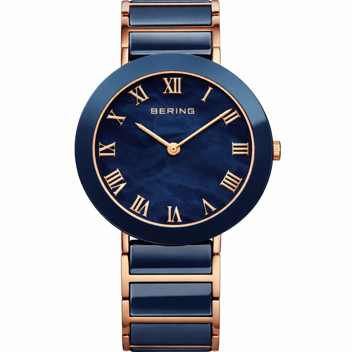 Bering watch with blue and rose gold design on a white background
