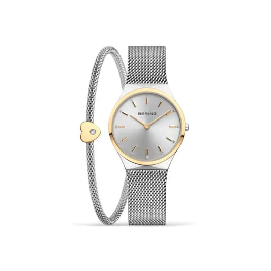 Watch with silver and gold mesh band on a white background