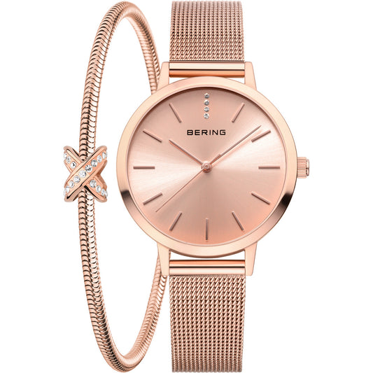 Rose gold watch with matching bracelet on a white background