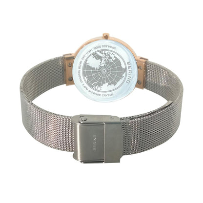 Silver watch with mesh band and rose gold accents on a white background