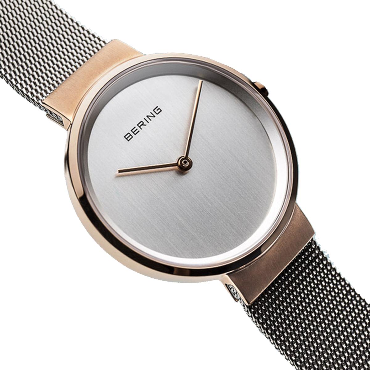 Bering watch with silver mesh band on a white background