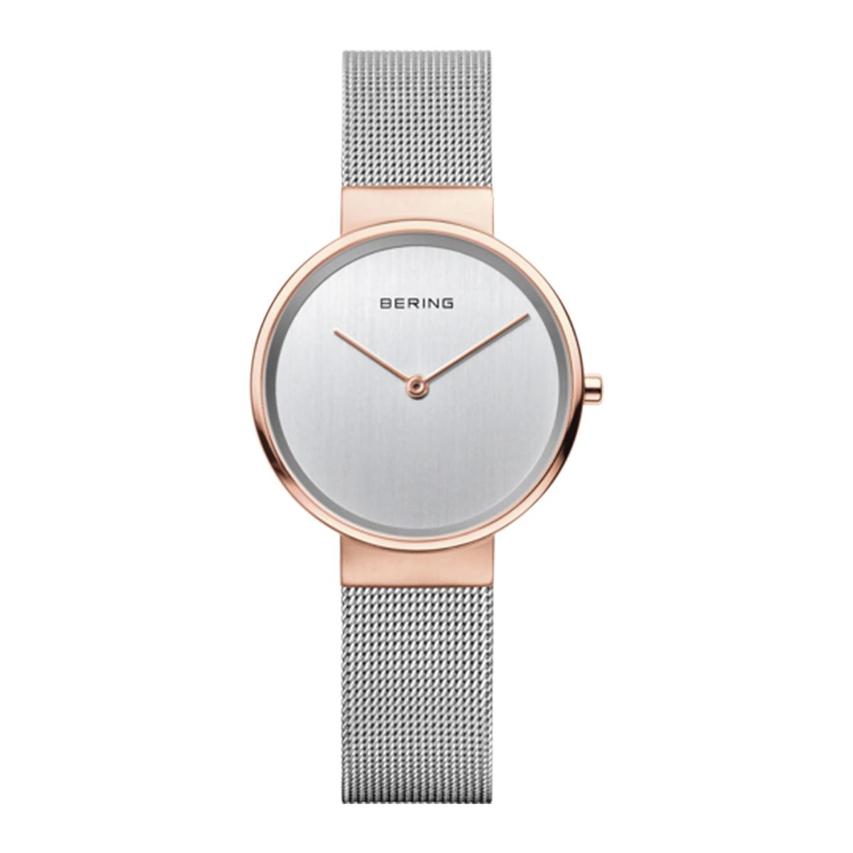 Bering watch with rose gold case and silver mesh band on a white background