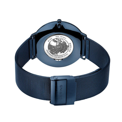 Blue watch with a detailed back cover on a white background