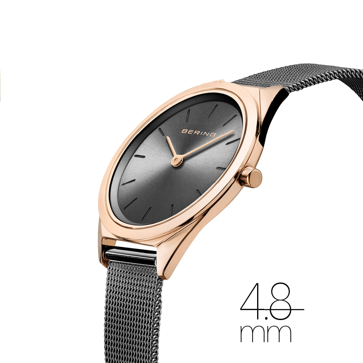 Wristwatch with rose gold case and gray mesh strap on white background