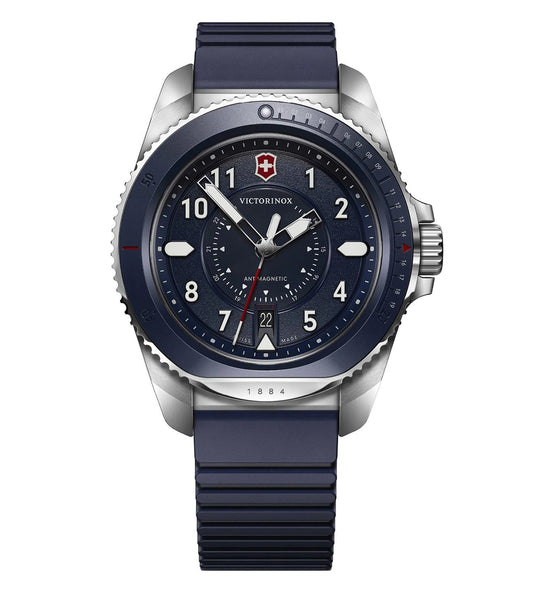 A Victorinox Journey 1884 men's watch with a blue rubber strap, silver case, and blue dial featuring a rotating bezel and date function.