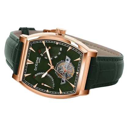 Green watch with rose gold case and green leather strap on a light gray background