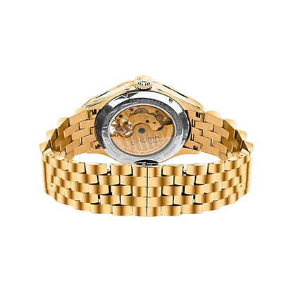 Gold wristwatch with a visible brand name on a light gray background