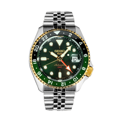Seiko watch with green dial and silver metal strap on a white background