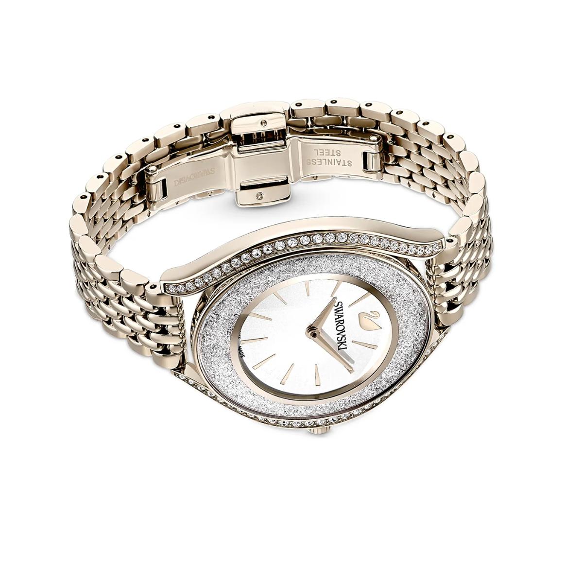 Gold watch with diamond-studded face on a white background
