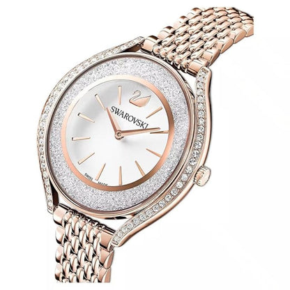Rose gold Swarovski watch with crystal embellishments on a white background