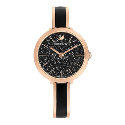 Swarovski watch with black face and rose gold case on a white background