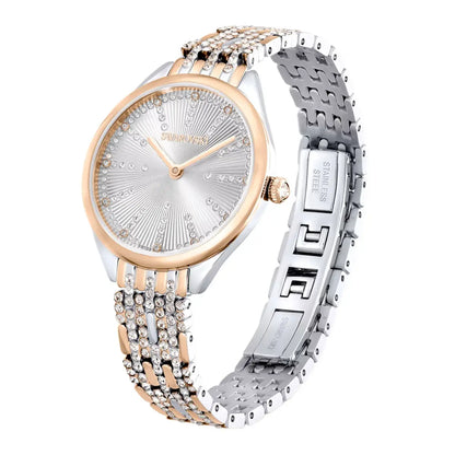 Two-tone watch with rose gold and silver band on a white background