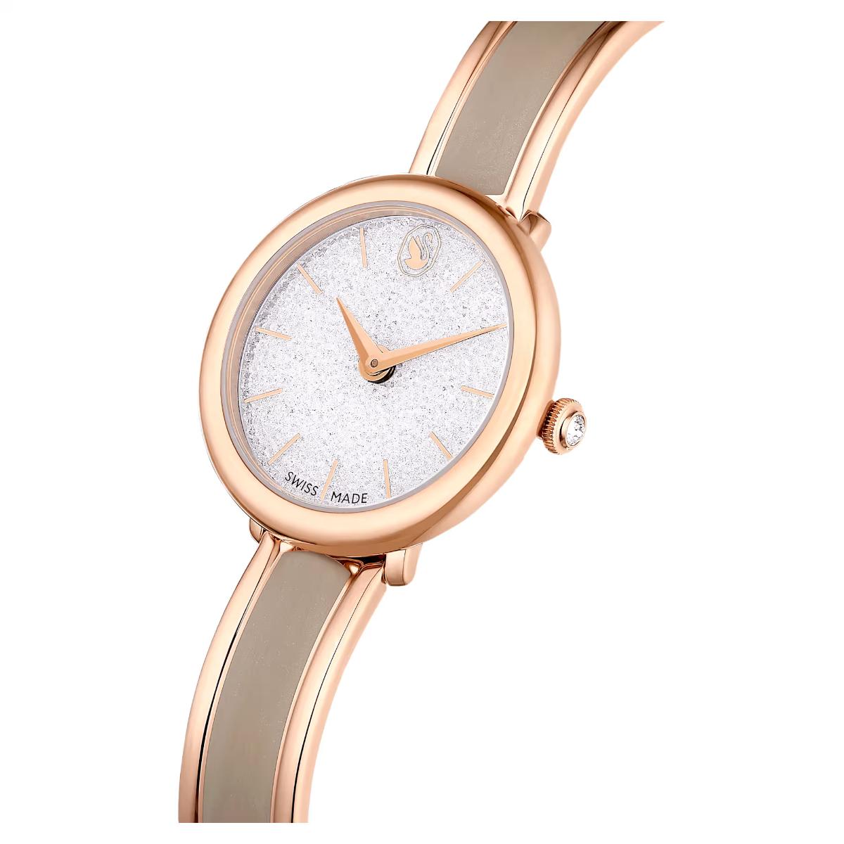 Rose gold watch with a white face on a white background