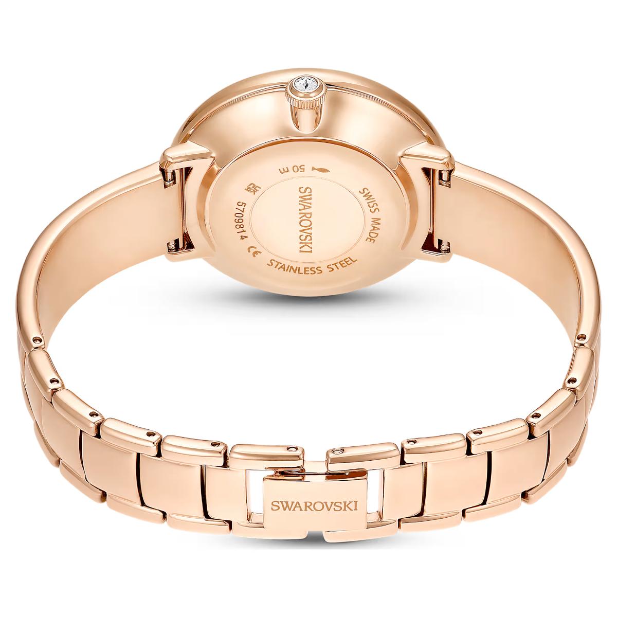 Rose gold Swarovski watch on a white background