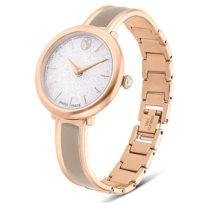 Rose gold watch with a white face on a white background