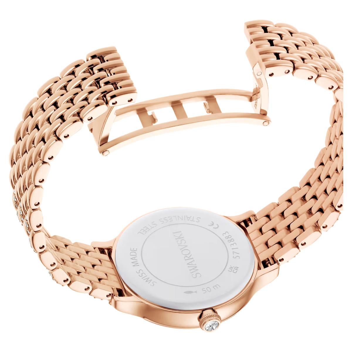 Rose gold watch with a white face on a white background