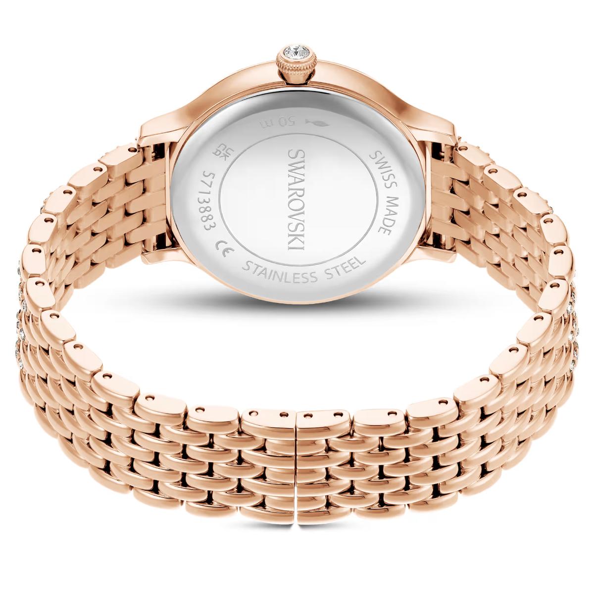 Rose gold Swarovski watch on a white background