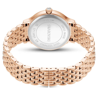 Rose gold Swarovski watch on a white background