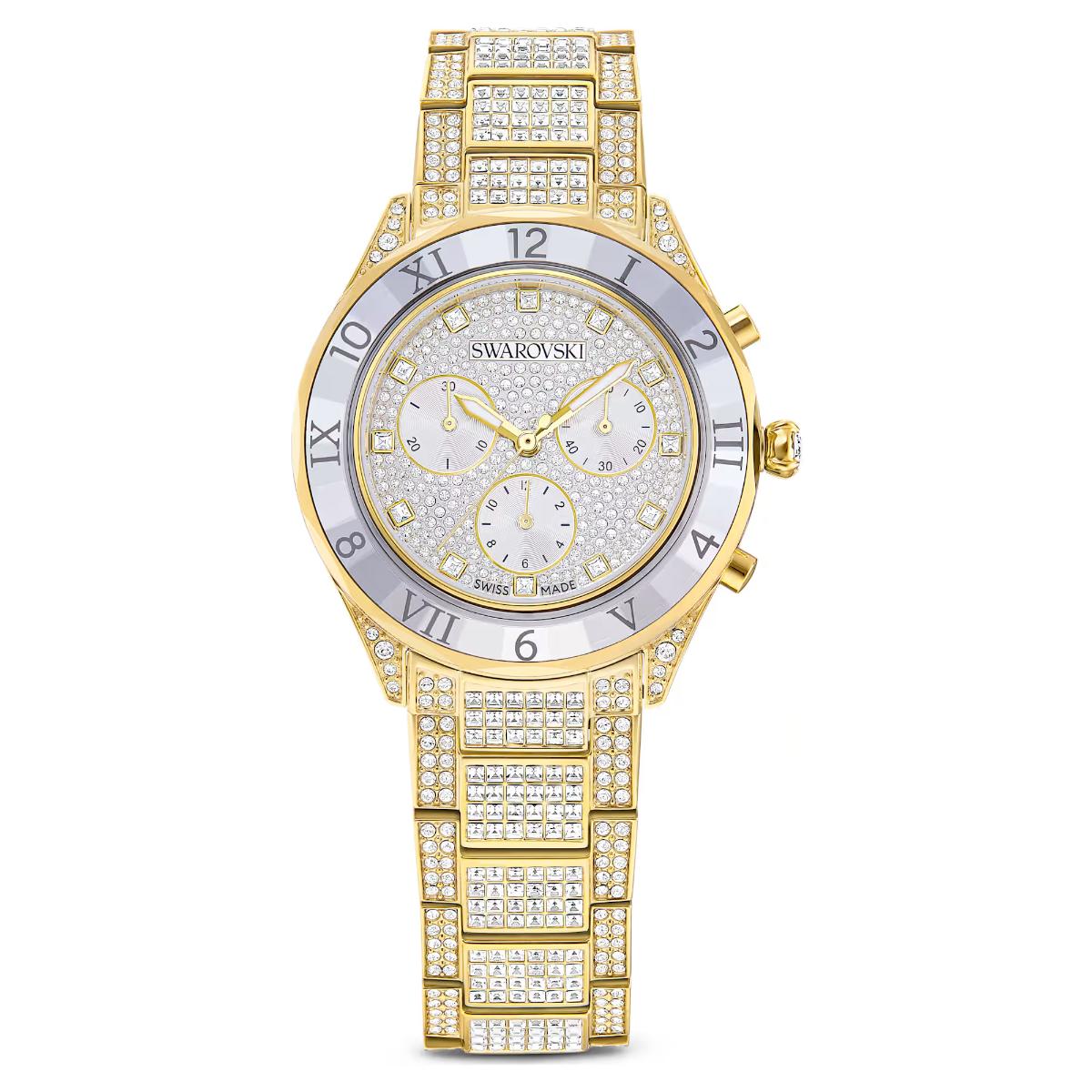 Gold Swarovski watch with diamond-studded band on a white background