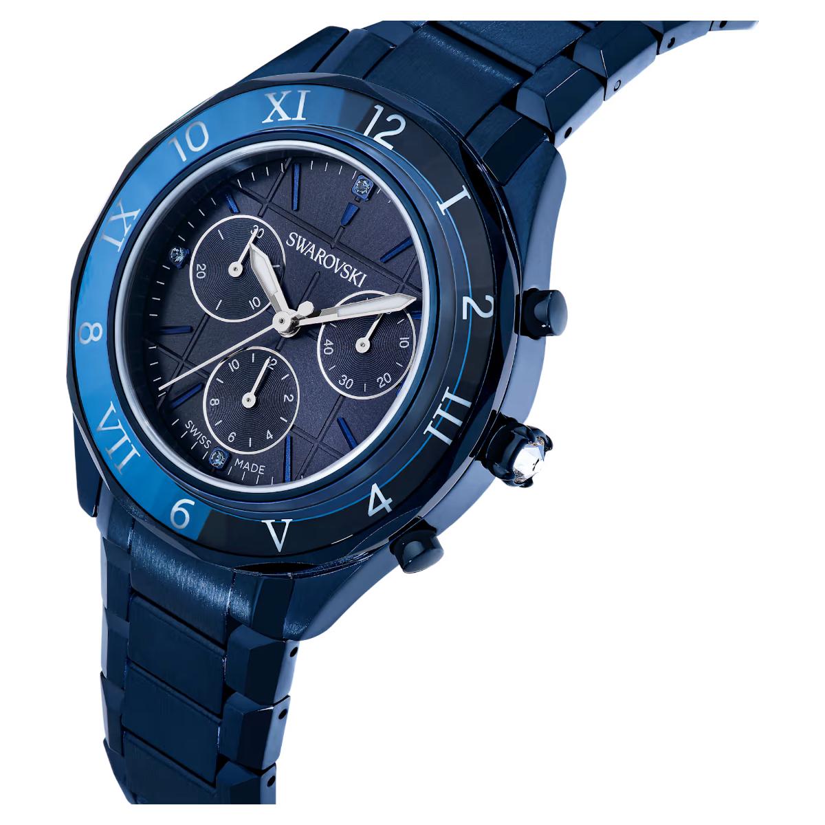 Blue Swarovski watch with detailed face on a white background