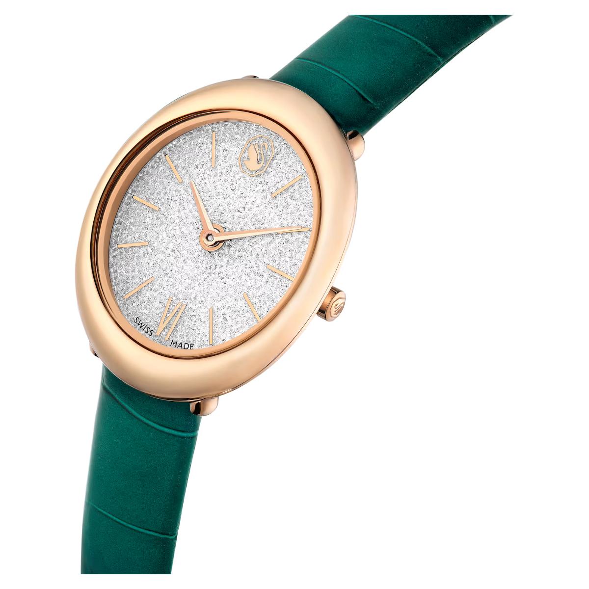 Watch with green strap and rose gold case on white background