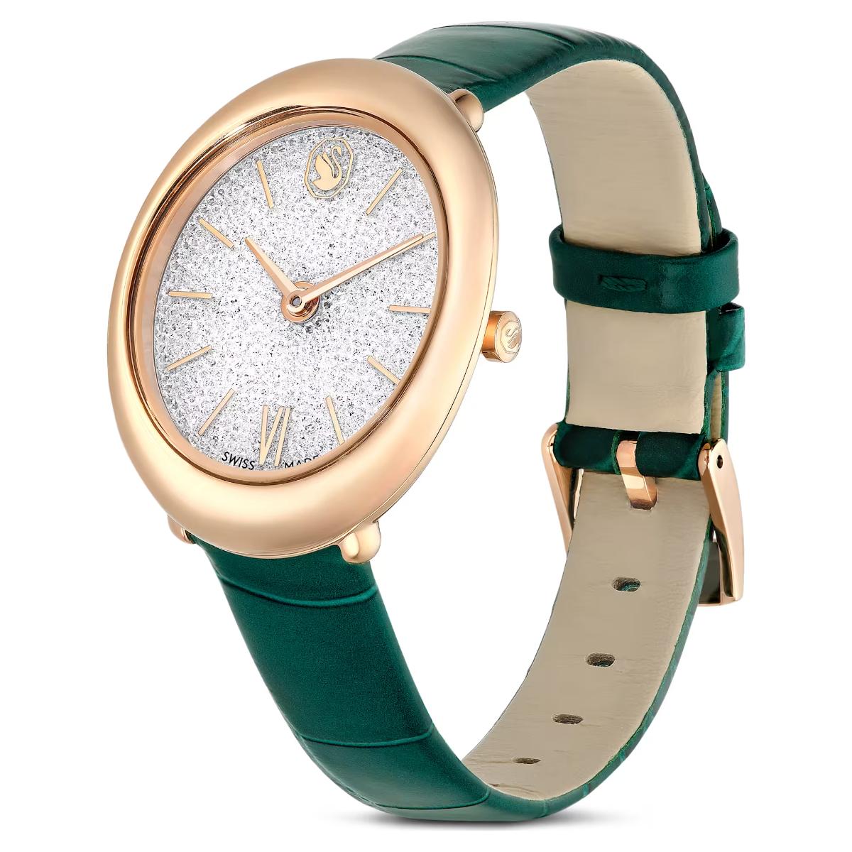Watch with green strap and rose gold case on a white background