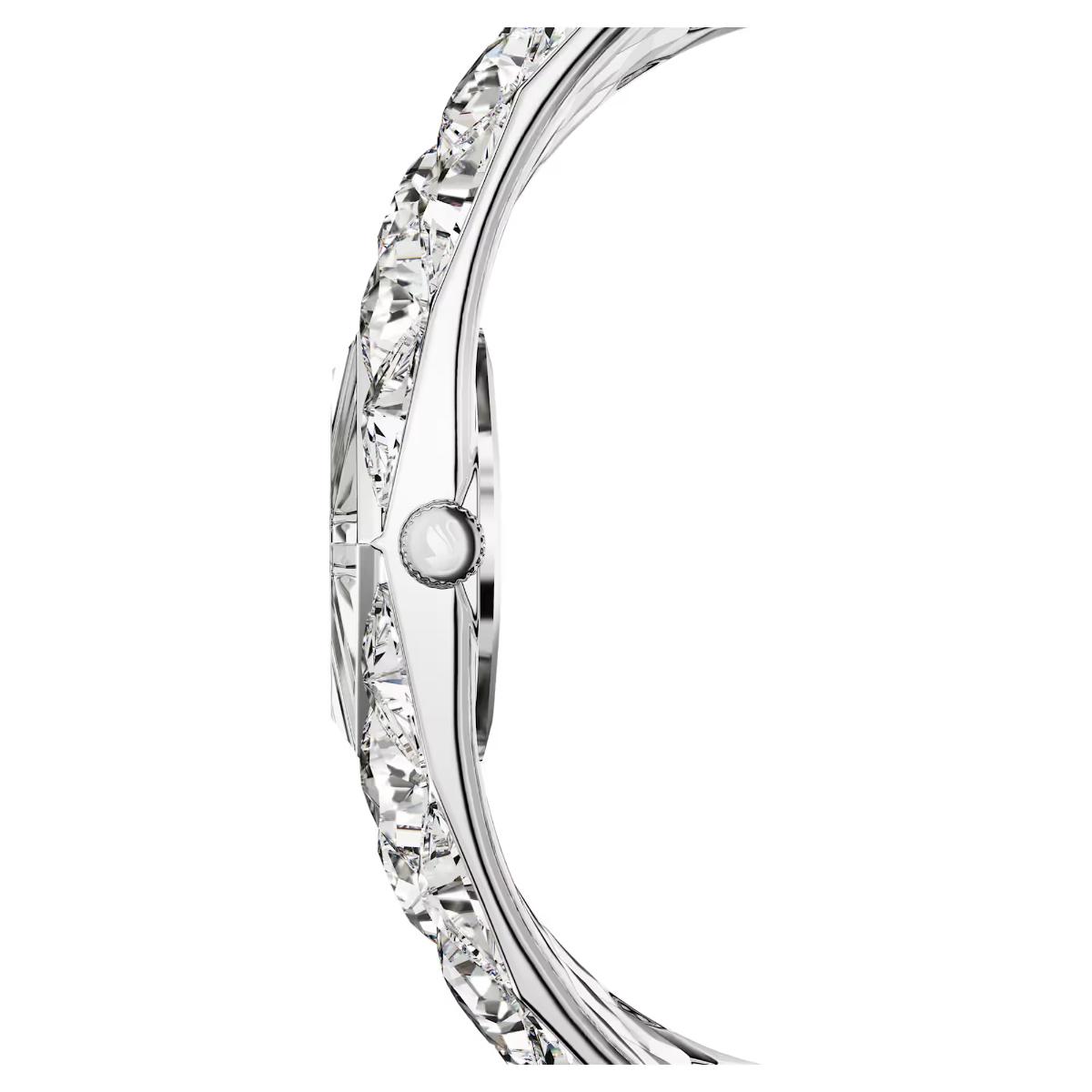 Close-up of a silver ring with clear gemstones on a white background