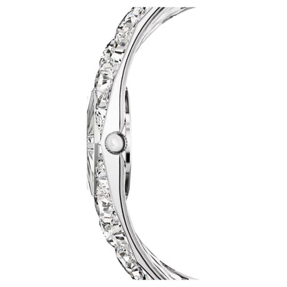 Close-up of a silver ring with clear gemstones on a white background