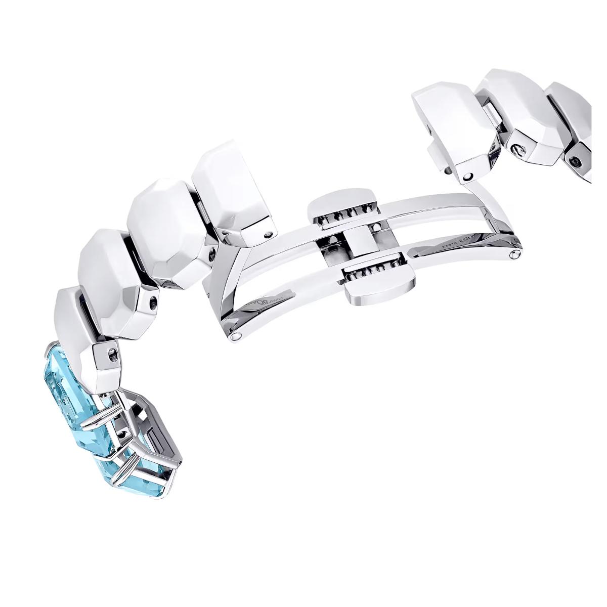 Silver bracelet with blue gemstones on a white background