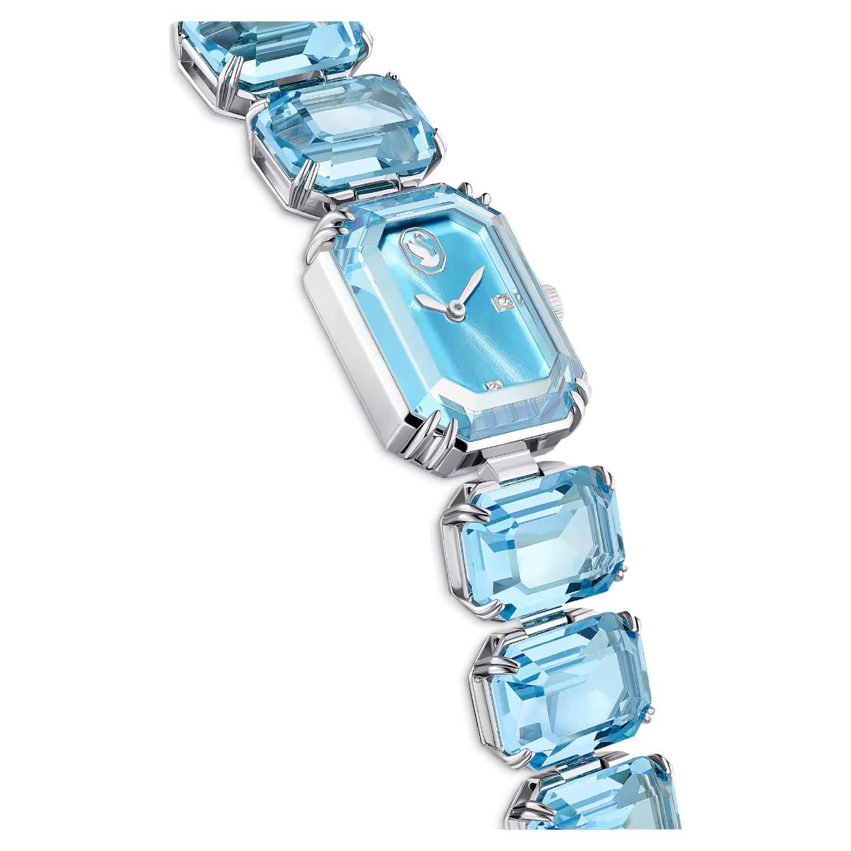Luxury watch with blue gemstones on a white background