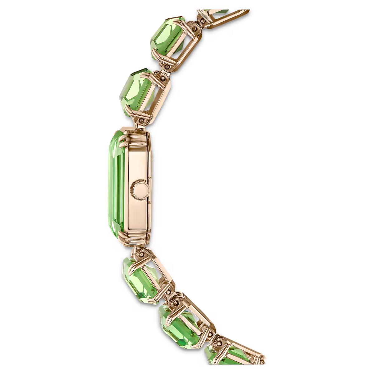 Gold bracelet with green gemstones on a white background
