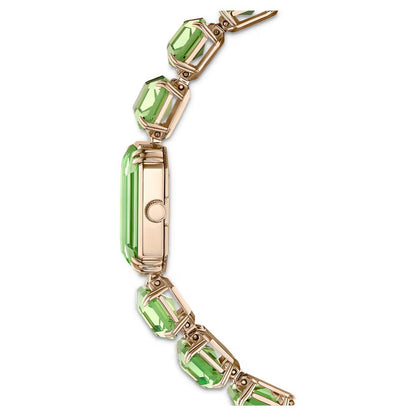 Gold bracelet with green gemstones on a white background