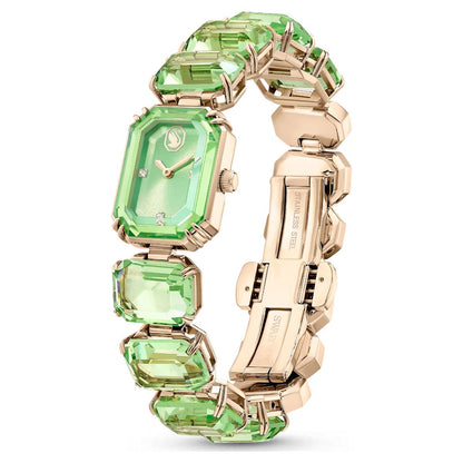 Gold bracelet with green gemstones on a white background