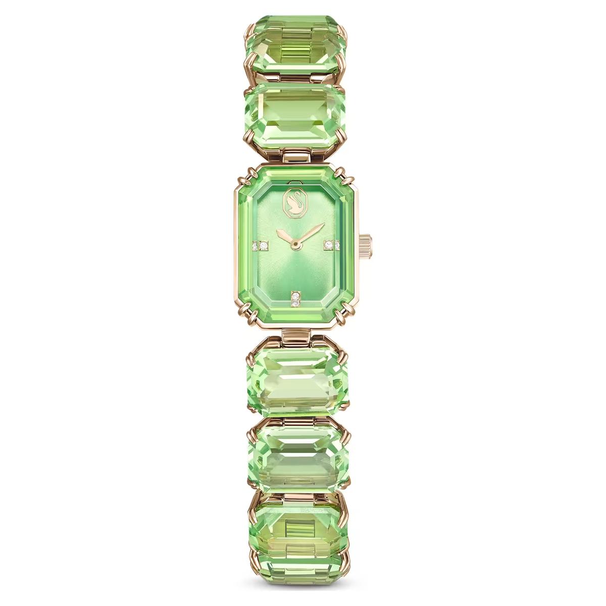 Green gemstone watch with gold accents on a white background