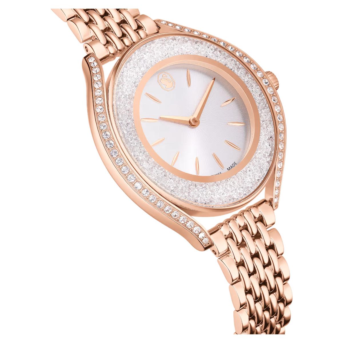 Rose gold watch with a white face on a white background