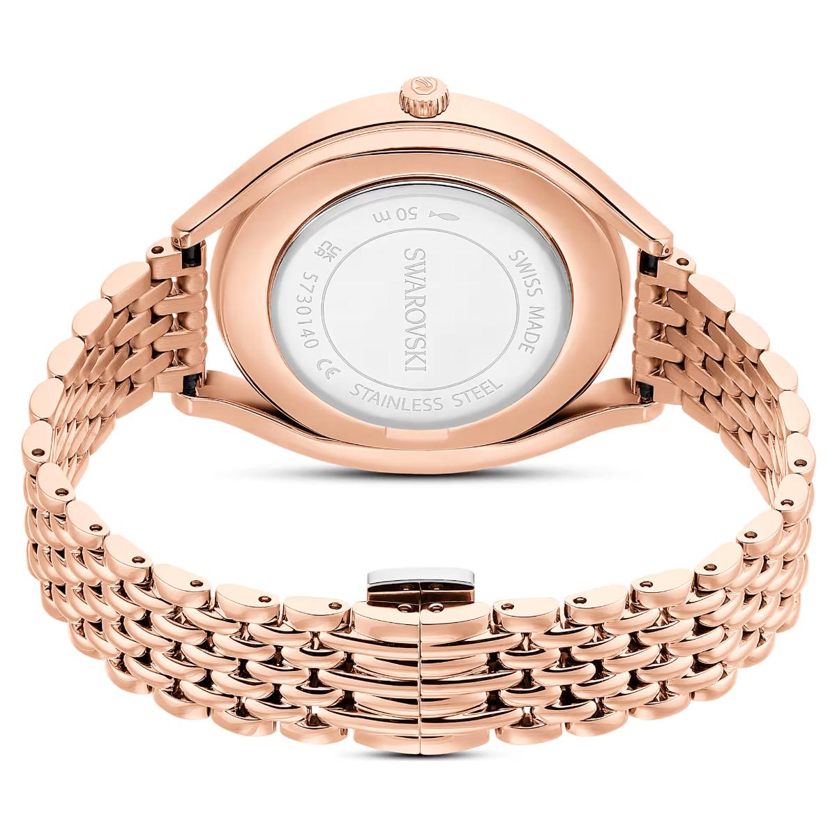 Rose gold watch with Swarovski branding on a white background