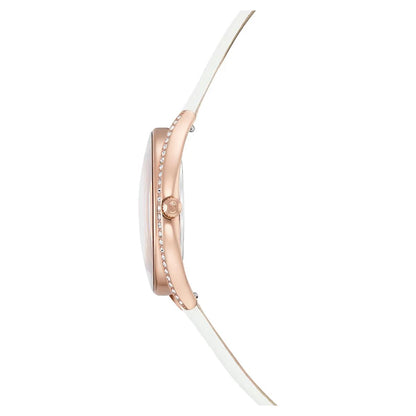 Close-up of a rose gold watch with a white strap on a white background