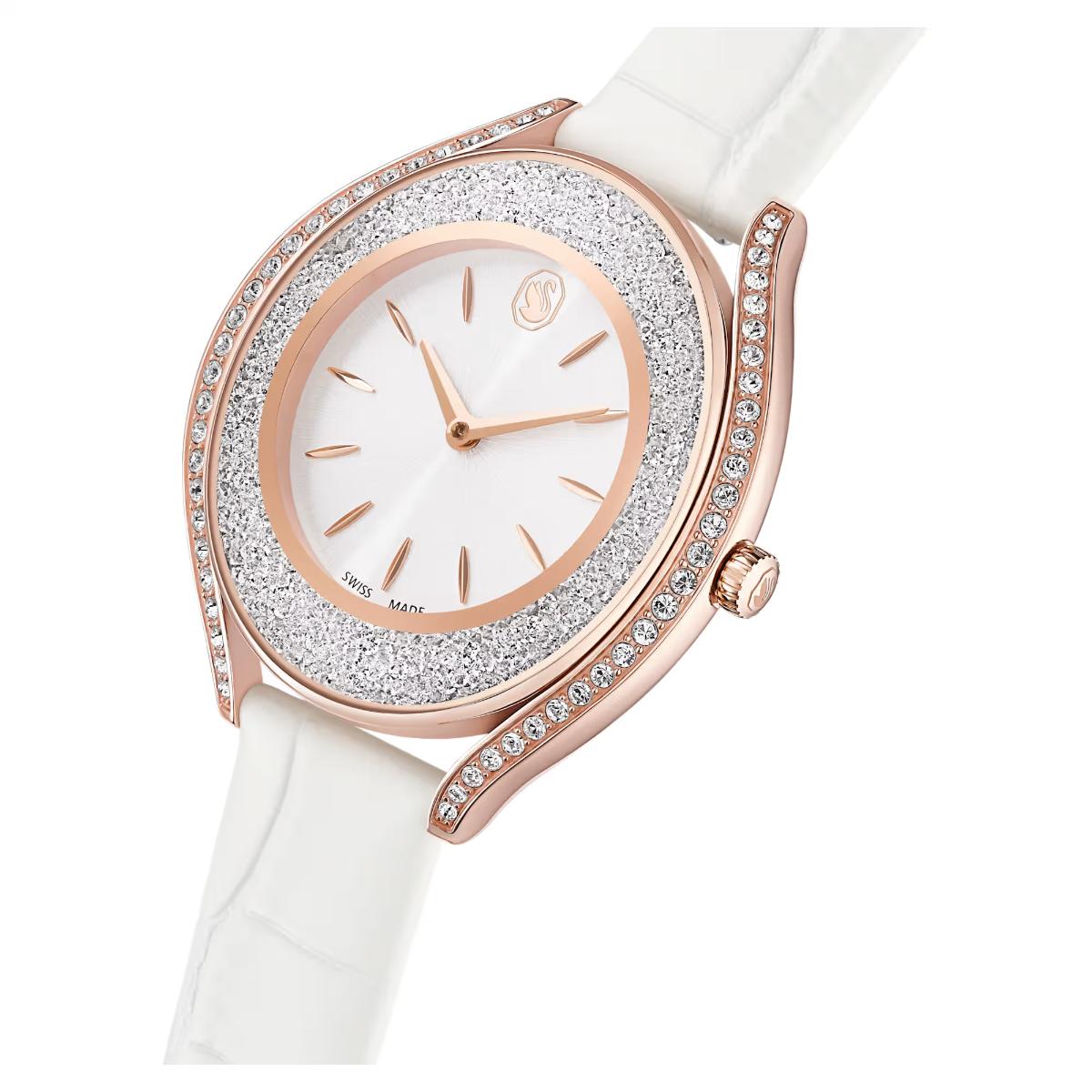 Luxury watch with rose gold case and white strap on a white background