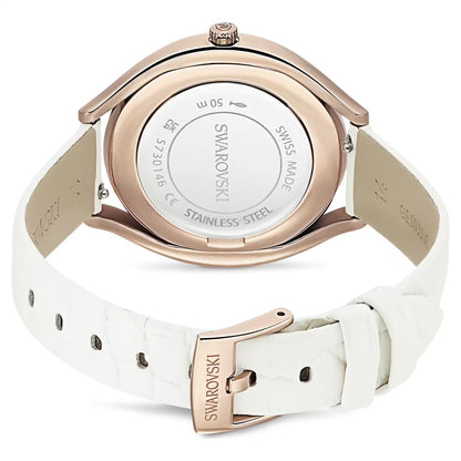 Swarovski watch with white strap and rose gold case on a white background