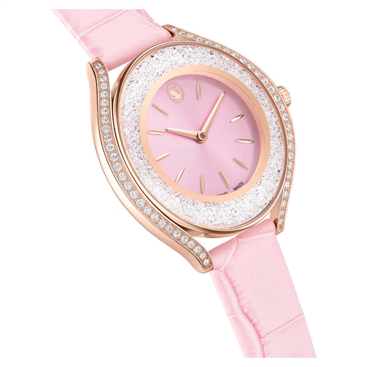 Pink watch with rose gold case and diamond-studded bezel on a white background