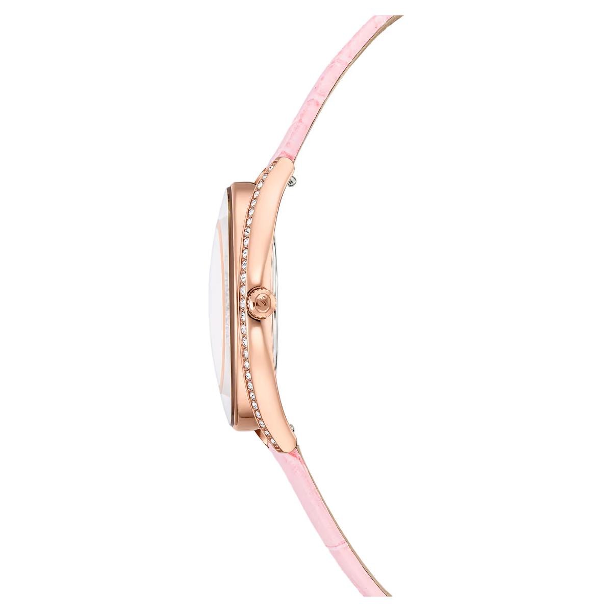 Watch with a pink strap and rose gold case on a white background
