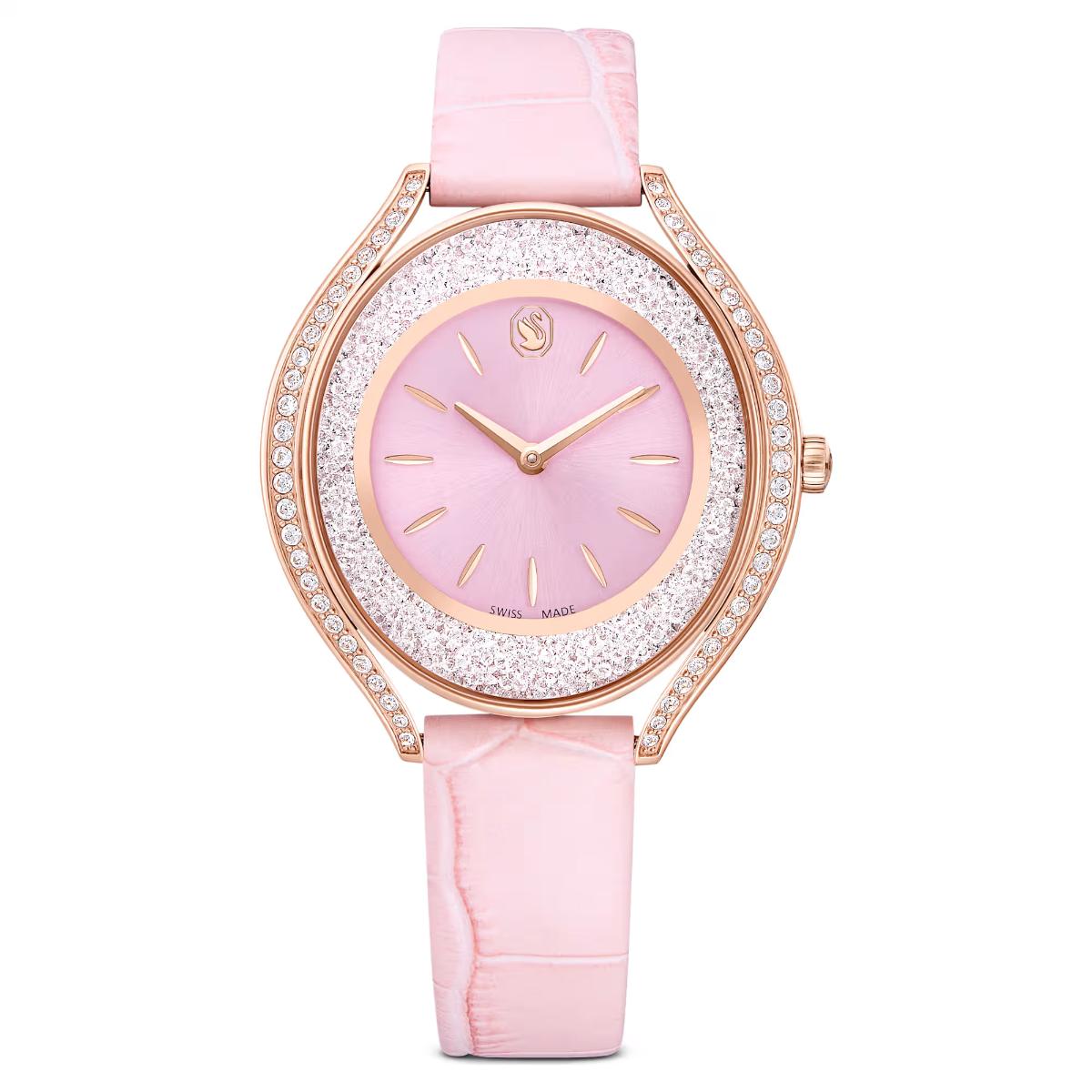Pink watch with rose gold accents on a white background